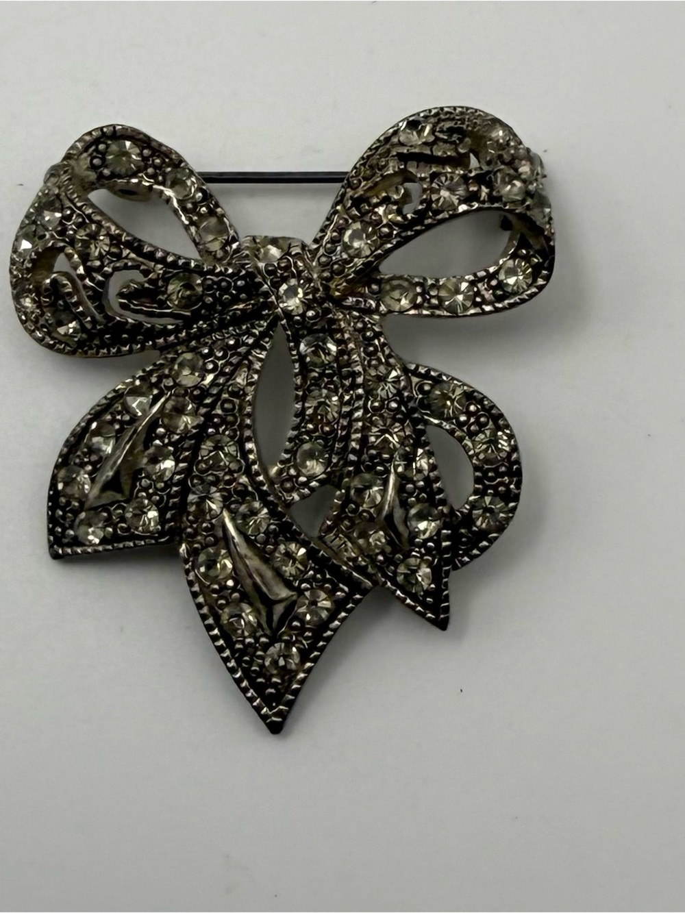 Source Unknown Silver Bow Pave Brooch with Clear Rhinestones